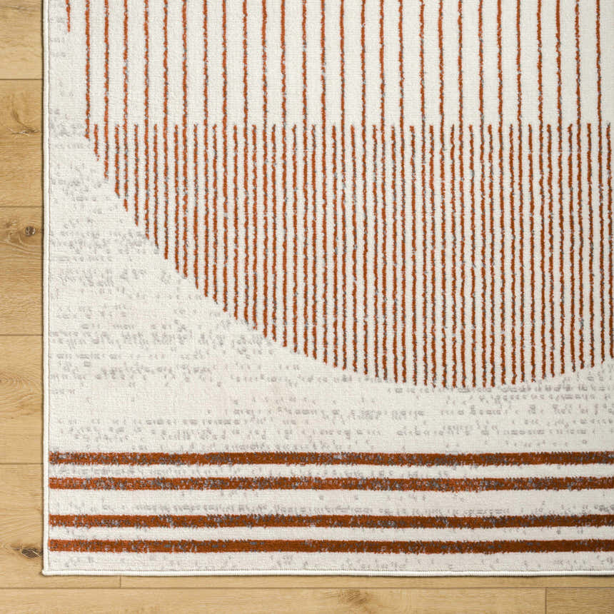 Close up of the Thono Area Rug showing burnt orange, charcoal, and light gray linear design. Swatch