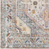 Close-up of the Thornley Area Rug showing its traditional, Southwestern pattern in blue, orange, pink, and yellow tones. Swatch