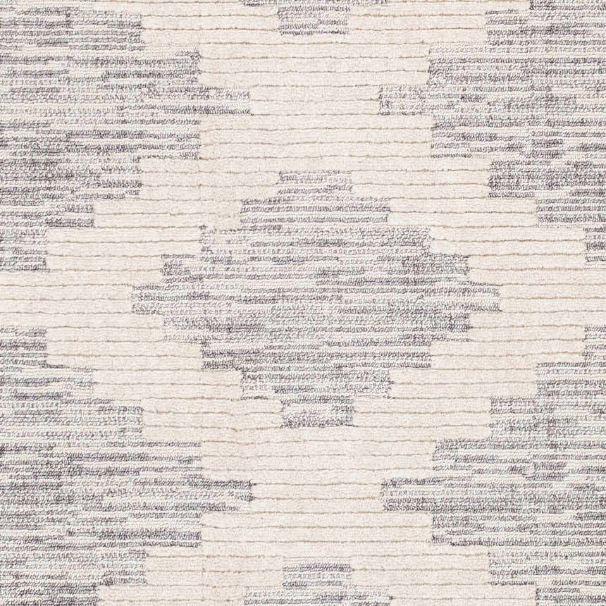 Close-up of Thornburg rug. Gray and ivory geometric pattern with a low pile and subtle texture. Swatch