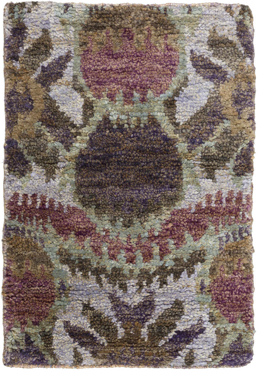 Close-up of the Thornville Jute Carpet. Southwestern style rug in brown, plum, pale blue and purple hues. Hand knotted texture. Design-Rectangle-23