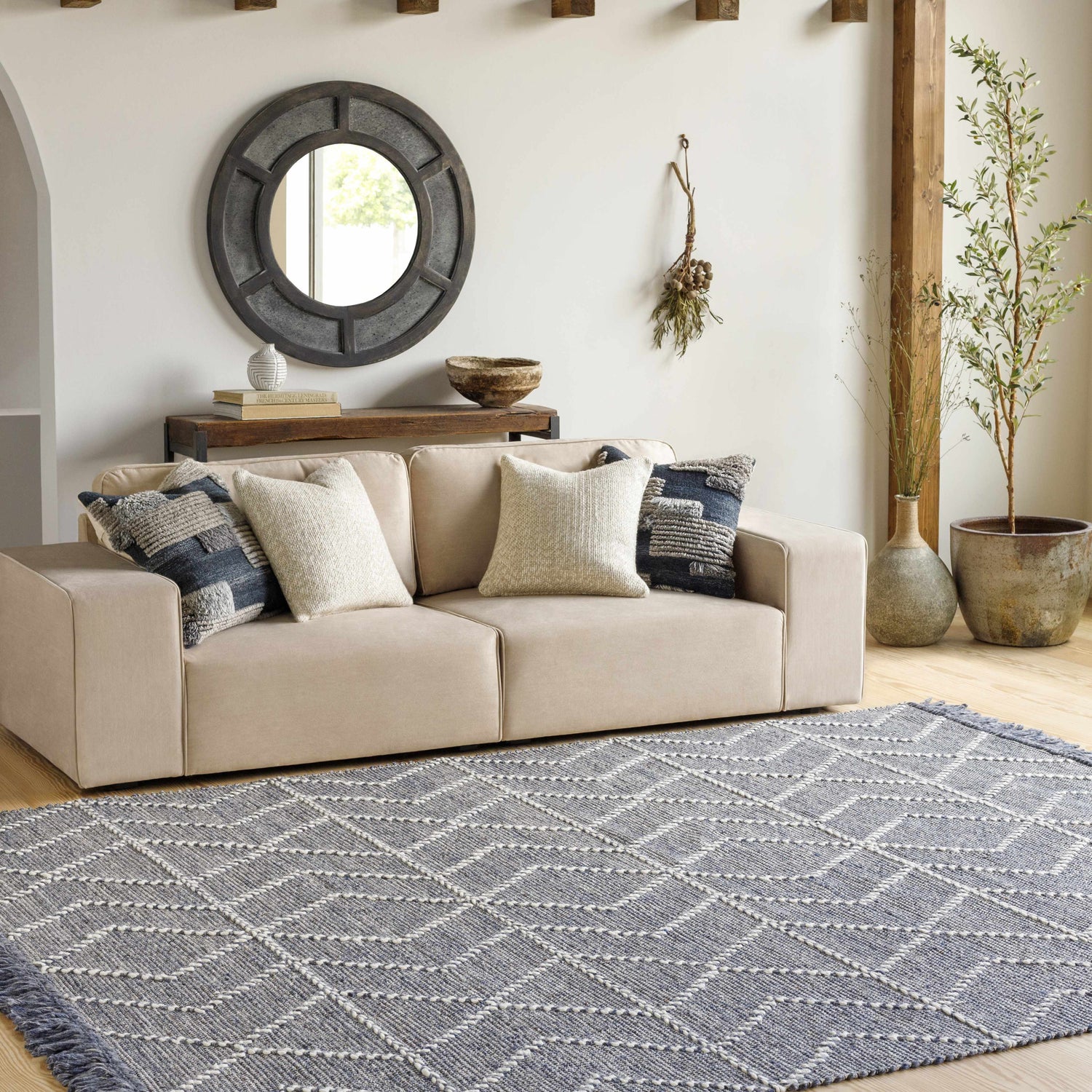 Living room scene with a beige sofa and the charcoal geometric Tidman Area Rug. Roomscene-Rectangle