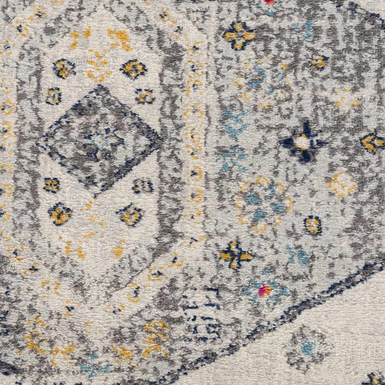 Close-up of the Tigried Ivory 2309 Area Rug, featuring a Bohemian pattern in ivory, gray, blue, and yellow hues. Texture