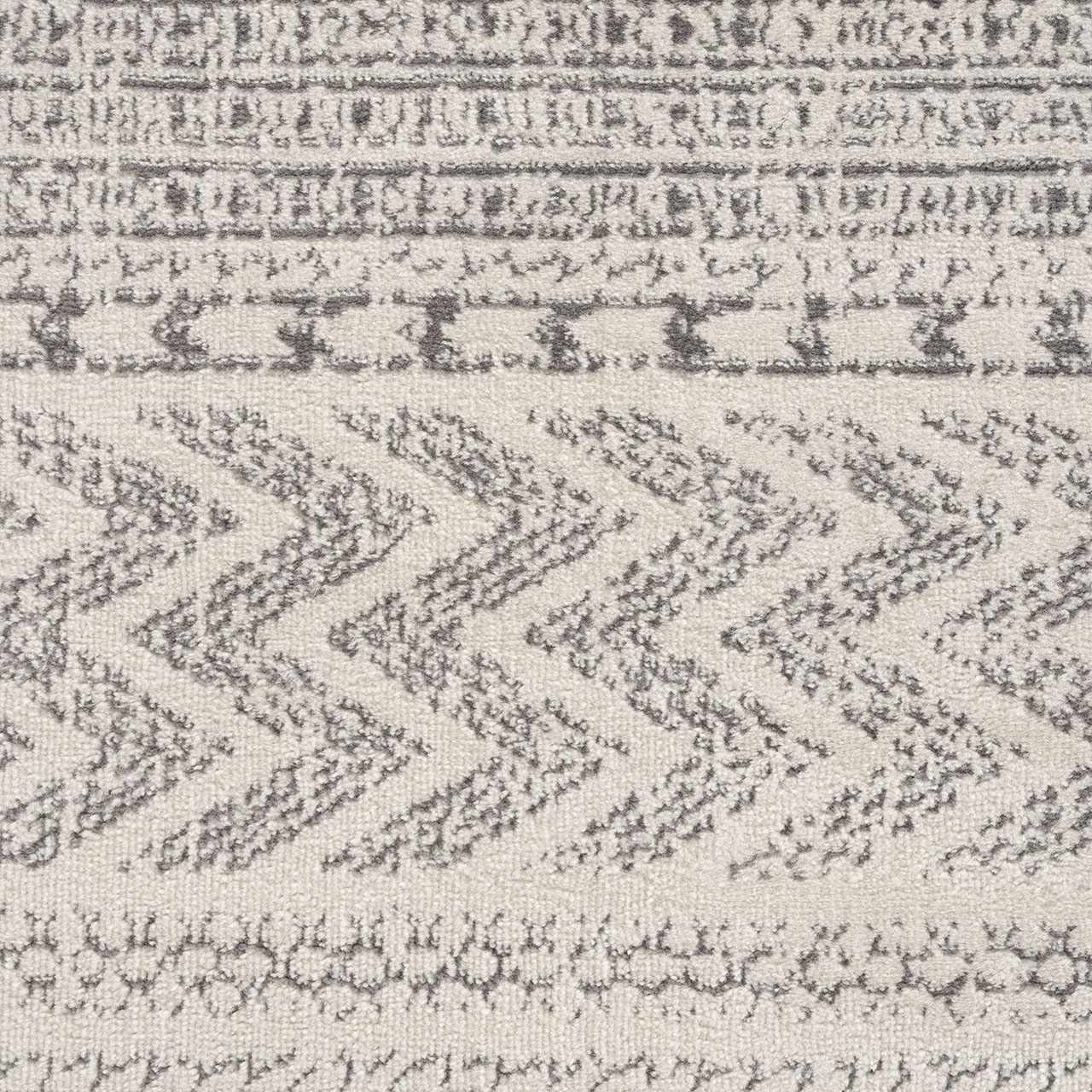 Close-up of Tigri Aztec Ivory & Gray 2311 Rug. Features a geometric, bohemian pattern in gray and ivory tones. Texture
