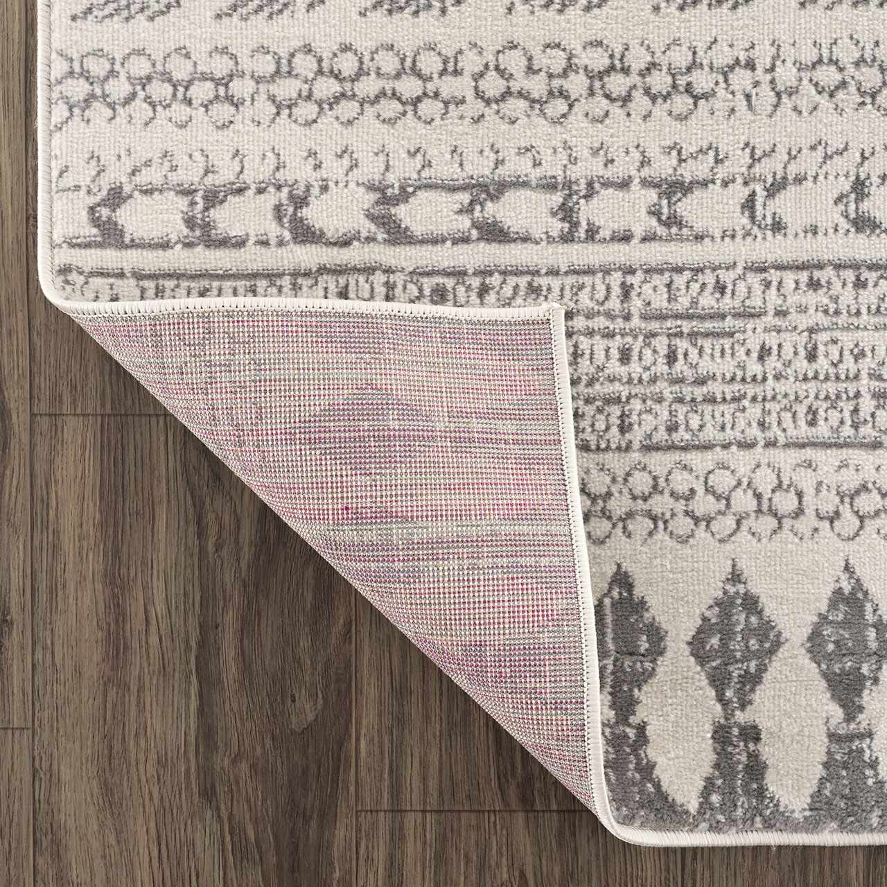 Close-up of the Tigri Aztec Ivory & Gray 2311 Rug showing the geometric pattern and material. Fold