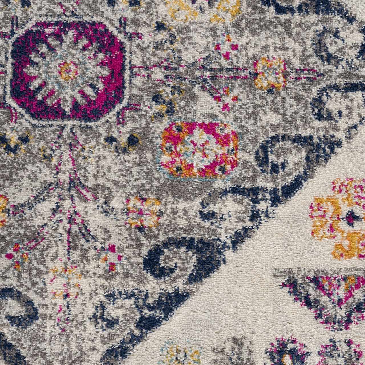 Close-up of Tigriv Ivory 2312 Area Rug. Features gray, ivory, navy, and orange bohemian-style floral pattern. Texture