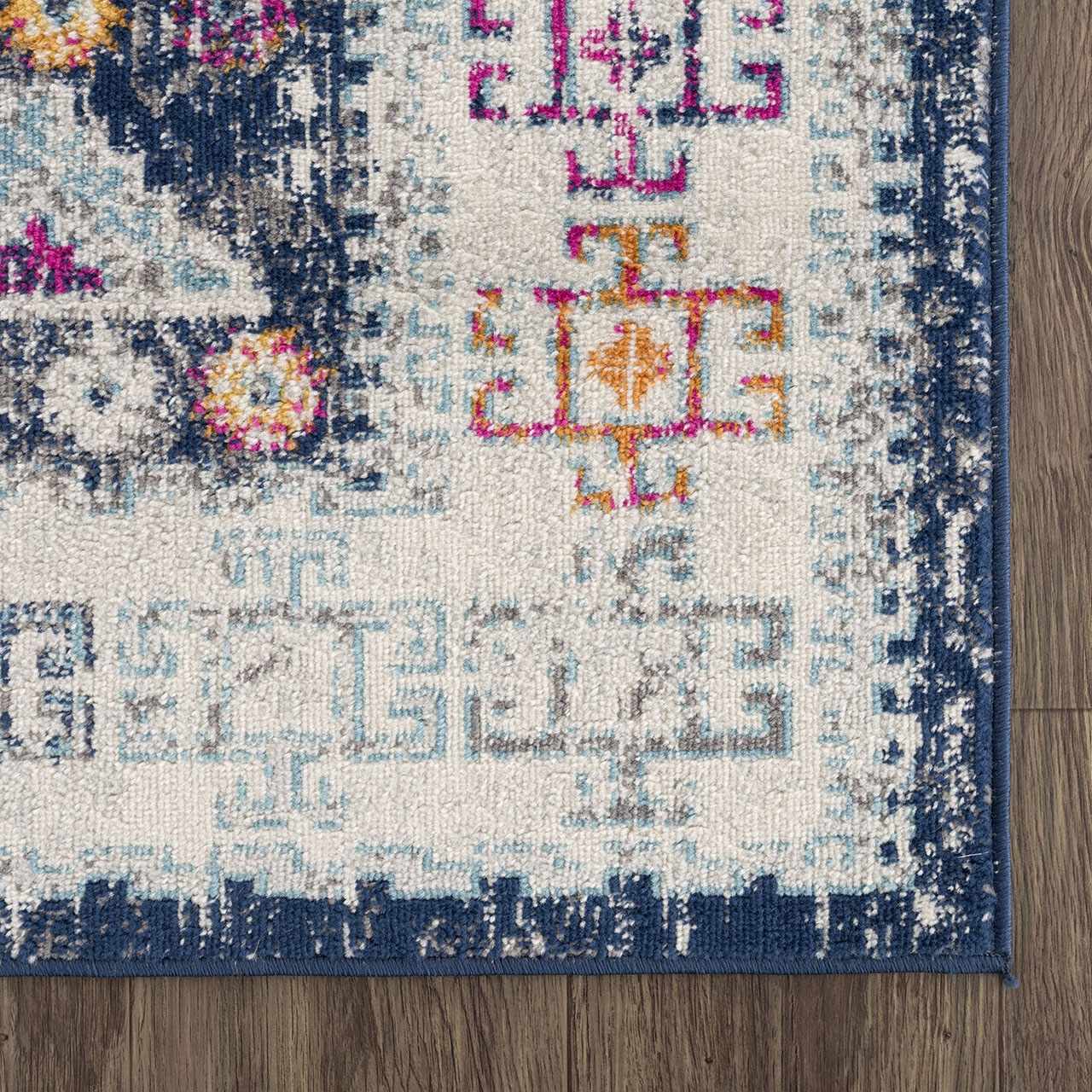 Close-up of Tigriv Navy 2313 rug showing bohemian design, navy border, and colorful geometric pattern. Swatch