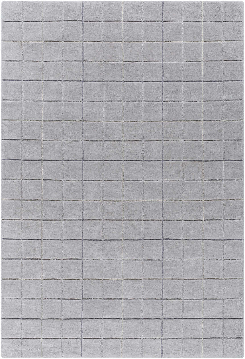 Close-up of the Toshi Sterling Gray Area Rug. Hand-tufted wool rug with a modern grid pattern in shades of gray and silver. Design-Rectangle-576