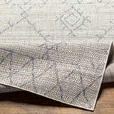 Close-up of the Marwood Gray&Blue Nordic Rug showing its geometric pattern, woven texture, and gray, blue, and off-white colors. Fold