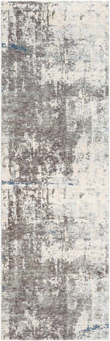 Close-up of the Tonalea Carved Statement Area Rug. Abstract design in shades of gray, ivory, and blue. Machine woven texture. Design-Runner-3310