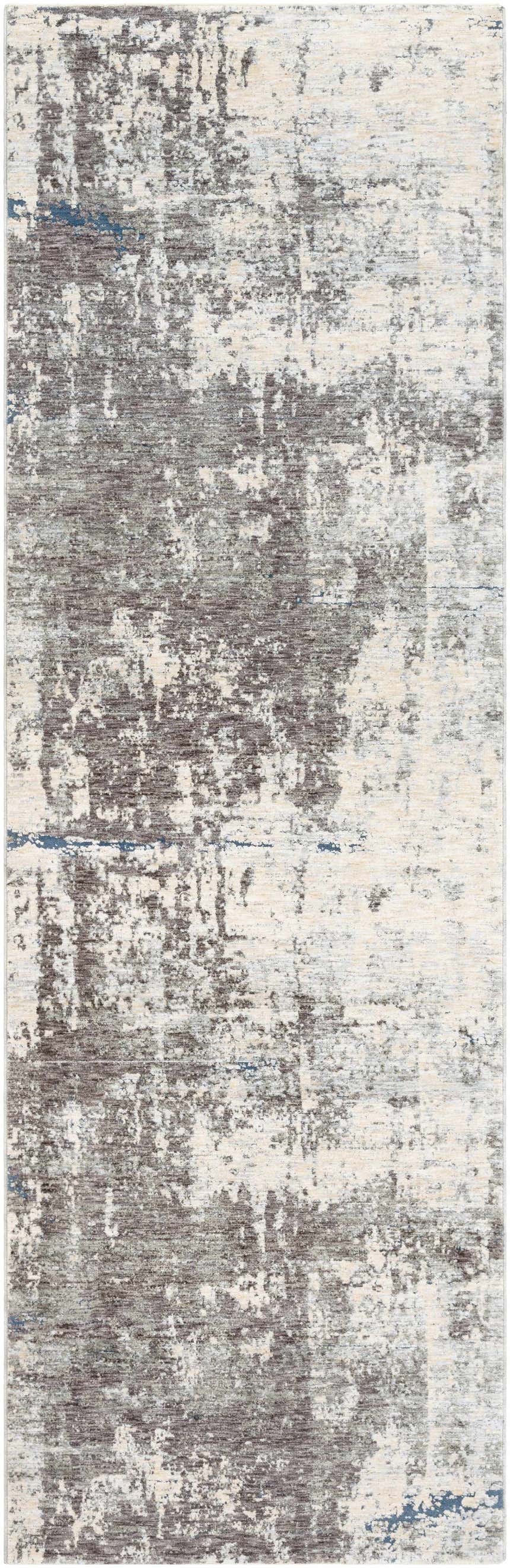 Close-up of the Tonalea Carved Statement Area Rug. Abstract design in shades of gray, ivory, and blue. Machine woven texture. Design-Runner-3310