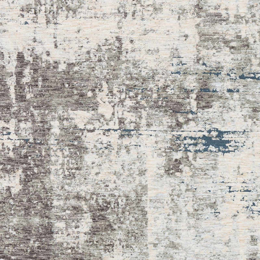 Close-up of the Tonalea Carved Statement Area Rug. Abstract design in ivory, gray, charcoal, and hints of blue. Soft texture. Swatch