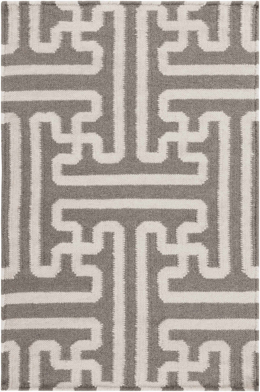 Close-up of the Tooele Area Carpet. Hand-woven wool rug with a cream and tan geometric pattern. Design-Rectangle