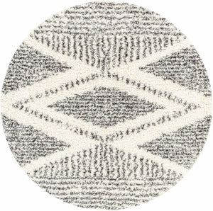 Close-up of round Trunding Plush Area Rug. Charcoal and cream shag rug with a diamond pattern. Design-Round-53