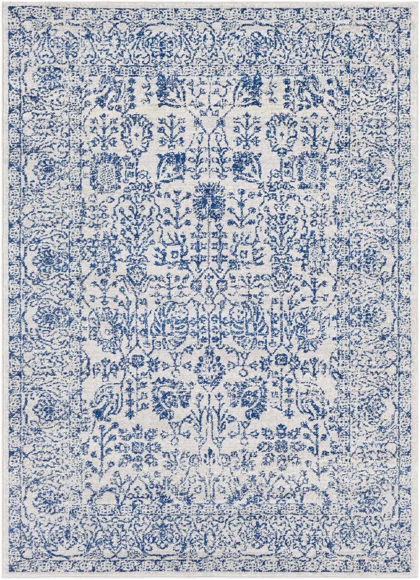 Close-up of the Truxton Area Rug. Light beige rug with a medium gray and navy vintage-style pattern. Design-Rectangle-5373