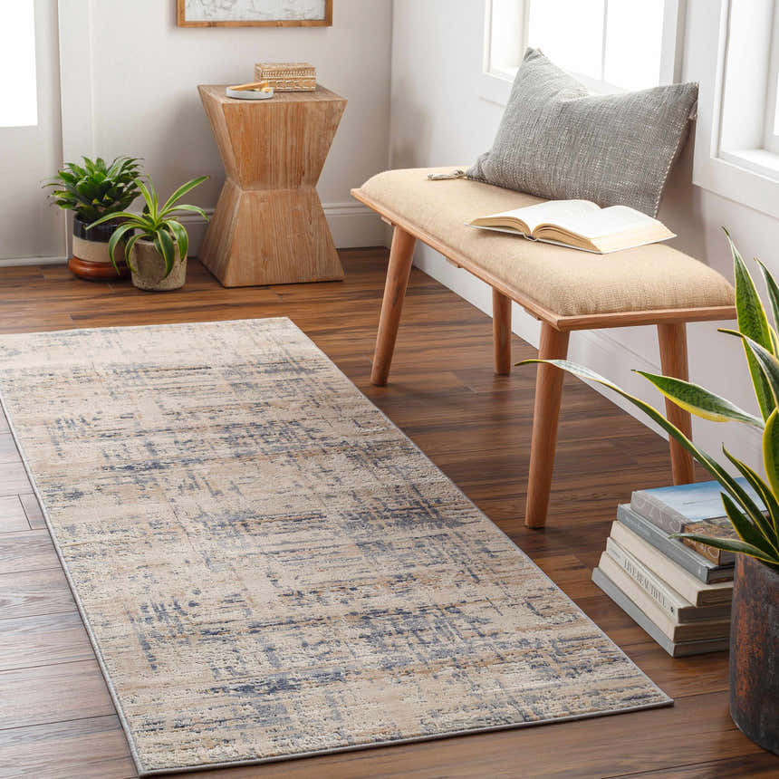 Entryway with a Tut Textured Luxe Rug runner in charcoal and ivory, bench, plants, and wood accents. Roomscene-Runner