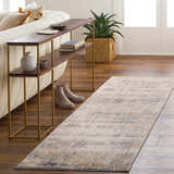 Living room scene with a Tut Textured Luxe Rug in beige and charcoal. Roomscene-Runner