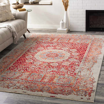 Living room scene with a red and gray hand-knotted Tulare Clearance Rug, sofa, fireplace, and gray wood floors. Roomscene-Rectangle