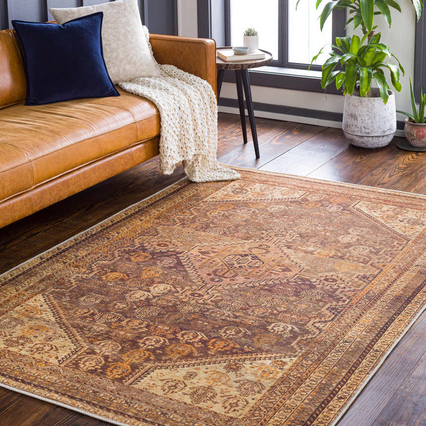 Living room scene with brown leather sofa and Tungao Washable Area Rug in brown, orange, and beige tones. Roomscene-Rectangle