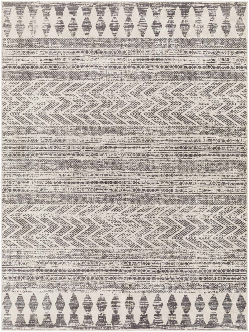 Close-up of the Tuy Area Rug. Bohemian style rug with dark gray, light gray, and nutmeg geometric patterns. Design-Rectangle-537