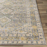Close-up of the Varnville Area Rug. Contemporary style with aqua, blue, charcoal, cream, gray, and mustard colors. Front