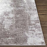 Close-up of the Victorias Area Rug showing charcoal, cream, and light gray abstract pattern and soft, textured polyester pile. Front