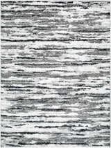 Close-up of the Vembo Area Rug. Contemporary design with black, gray, and silver horizontal stripes. Machine woven texture. Design-Rectangle-537