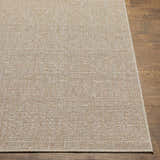 Close-up of the Vanderhoof Indoor & Outdoor Rug. Mocha and light peach tones with a subtle geometric pattern. Front
