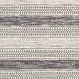 Close-up of the Vernonia Area Rug. Hand-woven wool rug with black stripes and ivory geometric patterns. Swatch