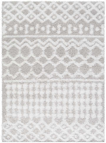 Close-up of the Vernonburg Shag Area Rug. Light gray and white shag rug with geometric diamond and zig-zag pattern. Soft texture. Design-Rectangle-5373