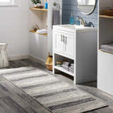 Bathroom scene with black and ivory Vernonia Area Rug runner on gray wood floor. Roomscene-Runner