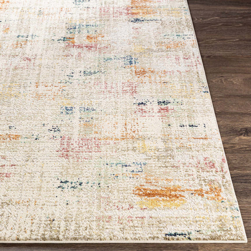 Close-up of the Eversley Area Rug. Cream rug with dark blue, pink, mustard, and sage abstract pattern. Front