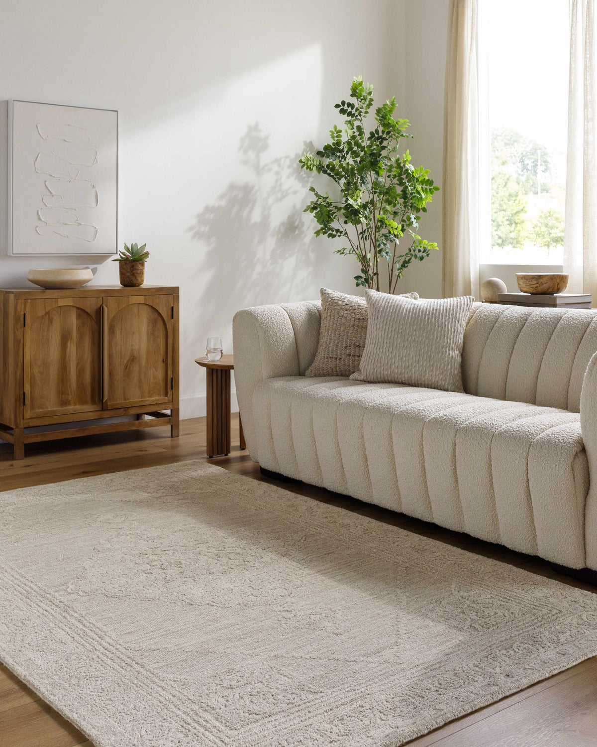 Living room with a cream couch and ash Verne Area Rug. Farmhouse style. Roomscene-Rectangle