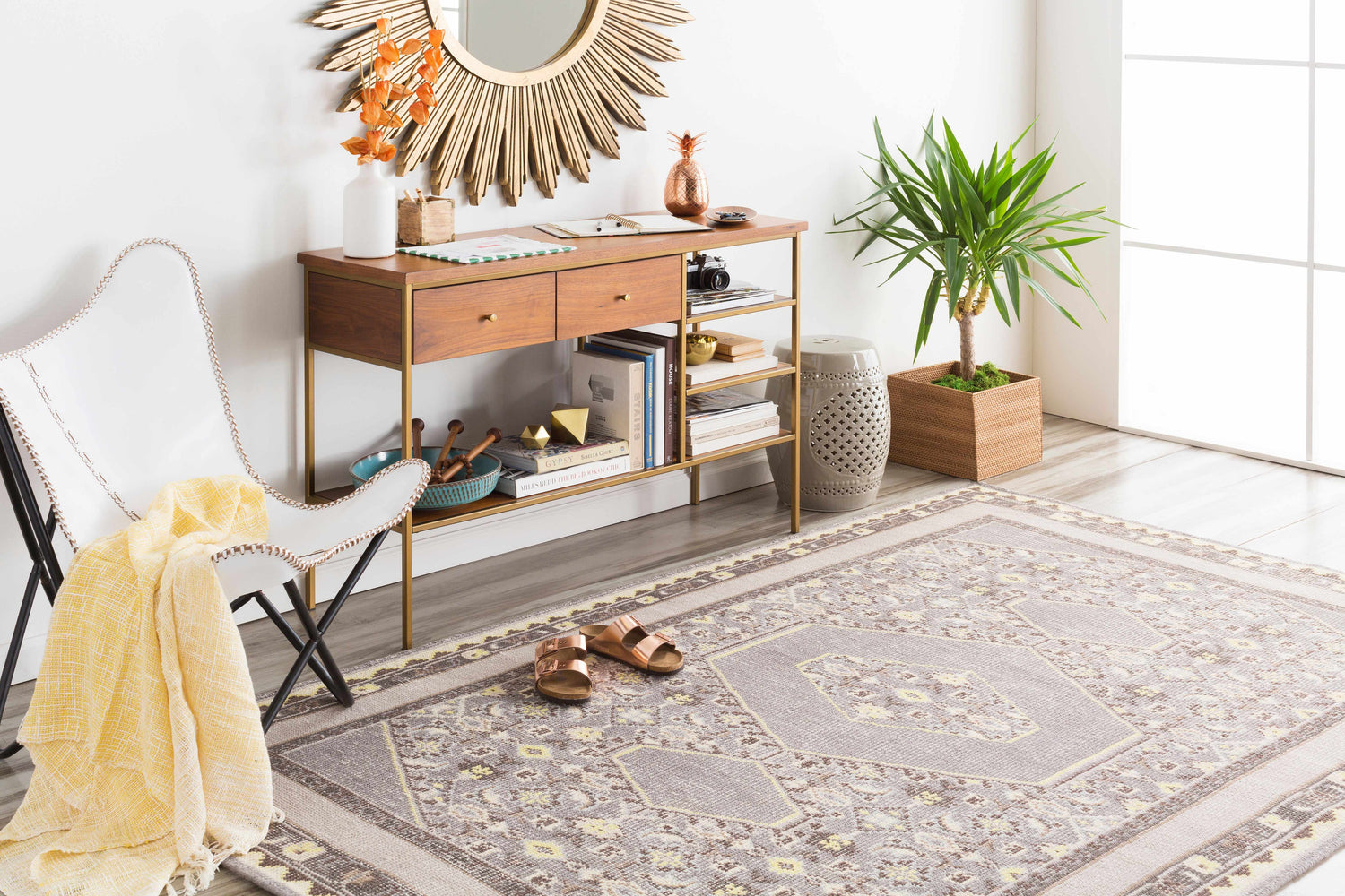 Styled room featuring the Walden Area Rug. Hand-knotted wool rug in gray, beige, and yellow with a traditional geometric pattern. Roomscene-Rectangle