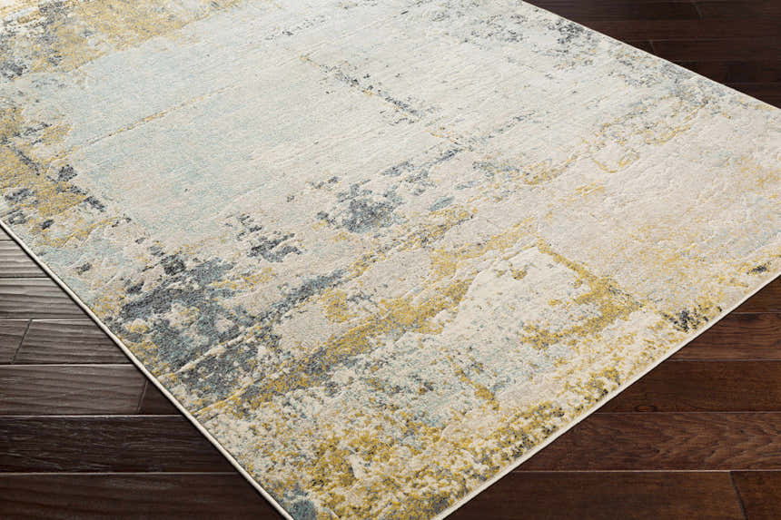 Close-up of Waleska Neutral Area Rug: contemporary design with aqua, black, mustard, and beige tones on dark wood floors. Corner