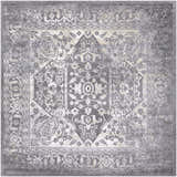 Close-up of the Watford Updated Traditional Tibetan Rug. Charcoal, gray, ivory, and tan vintage-style rug with floral and geometric patterns. Design-Square-710
