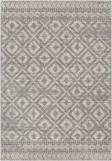 Close-up of the Webb Area Rug. Charcoal gray rug with a light slate and white diamond pattern. Bohemian style. Design-Rectangle-5373