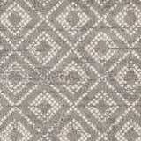 Close-up of the Webb Area Rug featuring a gray and white diamond pattern. Soft, textured weave. Swatch