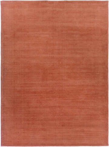 Close-up of the hand-loomed Brockton Solid Orange Wool Rug, showing its texture and burgundy color. Design-Rectangle