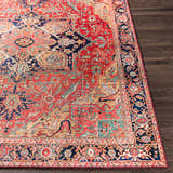 Close-up of the Whittingham Area Rug. Bohemian style with brick red, cream, dark blue, and brown oriental pattern. Front