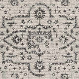 Close-up of the Willowbrook Area Rug showing a charcoal and gray vintage-style pattern on a light beige background. Texture