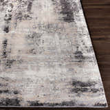 Close-up of the Witchford Abstract Charcoal Thick Rug, showcasing its black, gray, ivory, and tan pattern and texture. Front