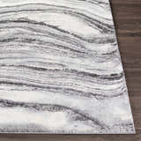 Close-up of the Walloon Gray Marble Thick Rug showing charcoal, gray, and ivory swirling pattern and texture. Front