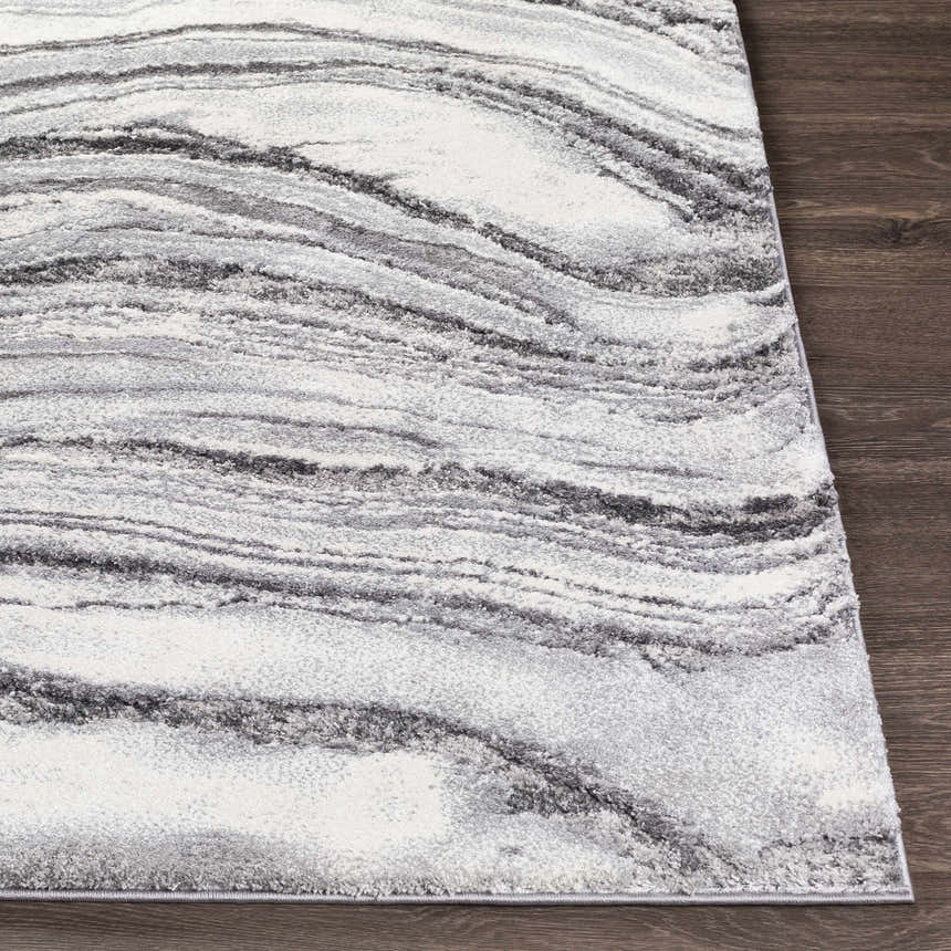 Close-up of the Walloon Gray Marble Thick Rug showing charcoal, gray, and ivory swirling pattern and texture. Front