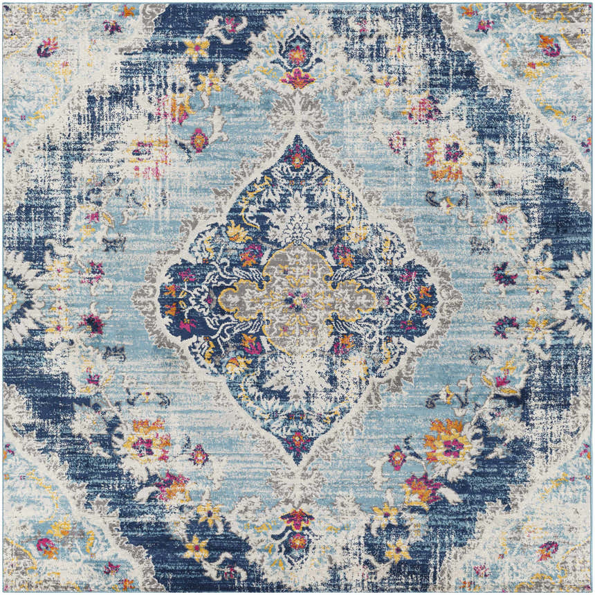 Close-up of the Wallsburg Blue Area Rug, a machine-woven rug with burnt orange, fuchsia, and navy floral accents. Design-Square-67