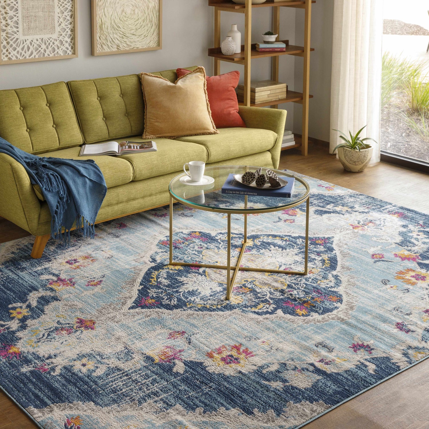 Living room scene with a Wallsburg Blue Area Rug, green sofa, and gold coffee table. Bohemian style. Roomscene-Rectangle