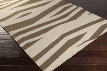 Close-up of the Wolford Area Carpet. Hand-woven wool rug with a contemporary brown and light beige zebra stripe pattern. Corner
