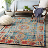 Living room scene with Wrangell Blue/Red Damask Carpet, wood chair, and knitted pouf. Bohemian, vintage style. Roomscene-Rectangle