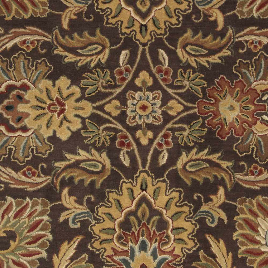 Close-up of the Chesterton 1028 rug. Hand-tufted brown wool with a traditional floral and paisley pattern in beige, red, and green. Swatch