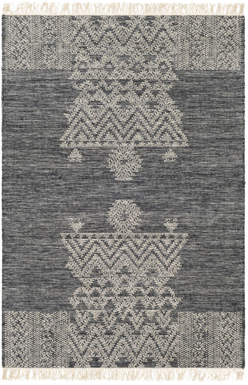 Close-up of the Warrawee Wool Rug. Hand-woven rug in cream, ink blue, and slate with a geometric pattern and fringed edges. Design-Rectangle-576
