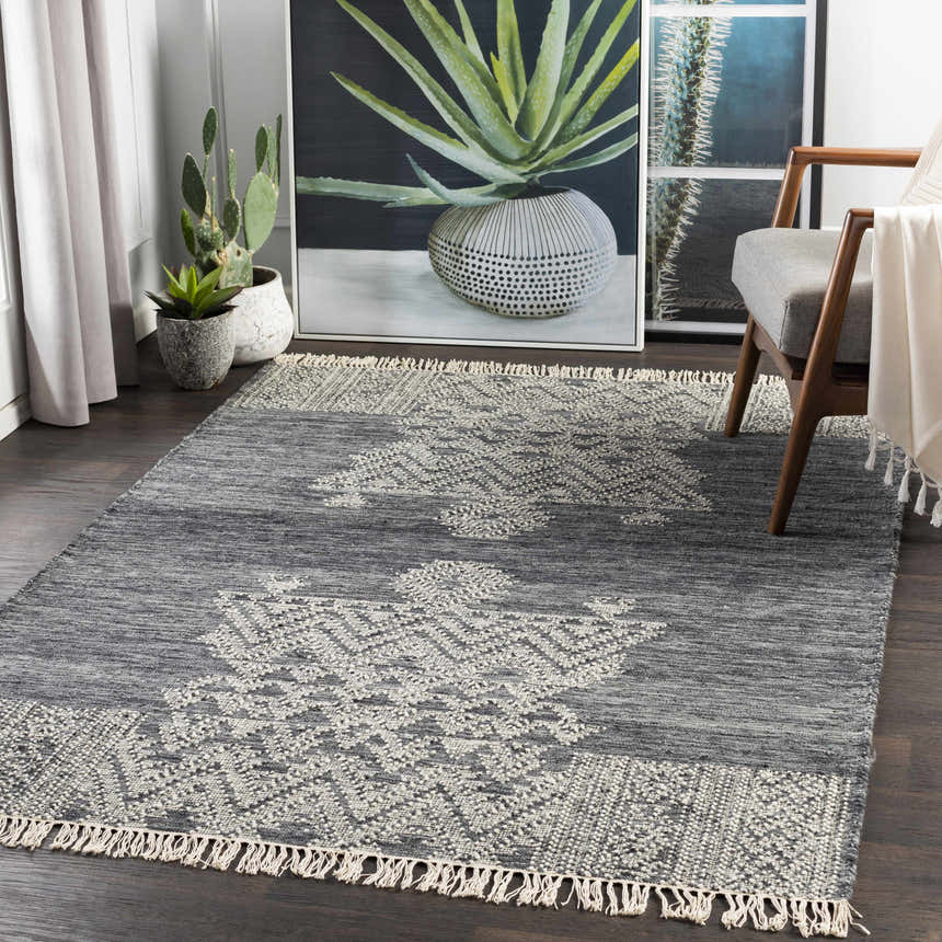 Living room scene with slate and cream Warrawee Wool Rug, wood chair, and potted cacti. Modern bohemian style. Roomscene-Rectangle